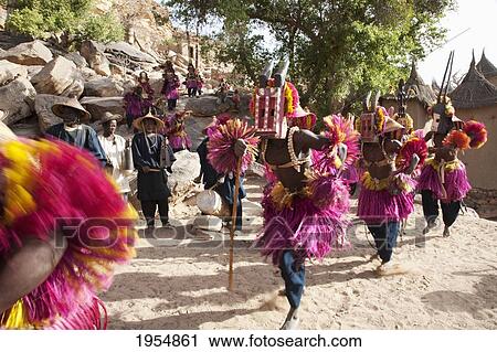 Dancers wearing Kananga masks perform at the Dama celebration in Tireli, Mali View Large Photo Image Stock Image - Dancers wearing Kananga masks perform at the Dama celebration in Tireli, Mali. Fotosearch