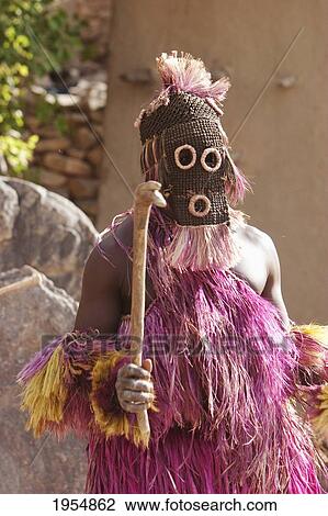 Stock Image - Dancers wearing Kananga masks perform at the Dama celebration in Tireli, Mali. Fotosearch