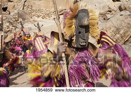 Dancers wearing Kananga masks perform at the Dama celebration in Tireli, Mali View Large Photo Image Stock Photo - Dancers wearing Kananga masks perform at the Dama celebration in Tireli, Mali. Fotosearch