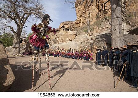 Dancers wearing Kananga masks perform at the Dama celebration in Tireli, Mali View Large Photo Image Stock Photograph - Dancers wearing Kananga masks perform at the Dama celebration in Tireli, Mali. Fotosearch