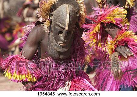 Stock Photography - Dancers wearing Kananga masks perform at the Dama celebration in Tireli, Mali. Fotosearch