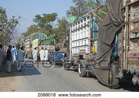 Stock Photo - Decorated Pakistani Trucks Carrying Relief Aid After The 8 October 2005 Earthquake, Kohala, Azad Kashmir, Pakistan. Fotosearch