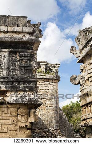 Detailed stone carvings on ancient Mayan buildings with blue sky and clouds; Chichen Itza, Yucatan, Mexico View Large Photo Image Stock Image - Detailed stone carvings on ancient Mayan buildings with blue sky and clouds; Chichen Itza, Yucatan, Mexico. Fotosearch