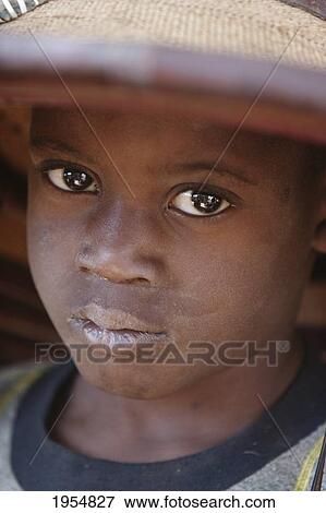 Stock Photo - Dogon boy wearing a hat in Tireli, Mali. Fotosearch