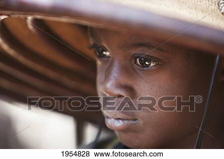 Dogon boy wearing a hat in Tireli, Mali View Large Photo Image Stock Photo - Dogon boy wearing a hat in Tireli, Mali. Fotosearch