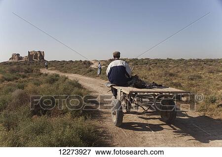Donkey cart on track towards Little Kyz Kala, Merv, near Mary City; Turkmenistan View Large Photo Image Stock Photo - Donkey cart on track towards Little Kyz Kala, Merv, near Mary City; Turkmenistan. Fotosearch