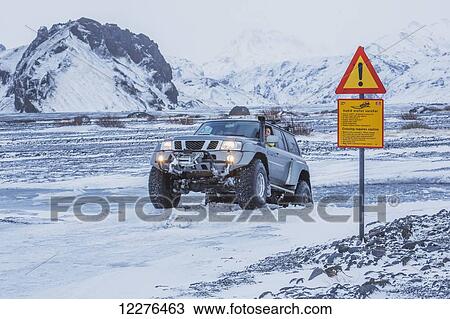 Driving a super jeep through a very deep puddle in the south of Iceland; Iceland View Large Photo Image Stock Image - Driving a super jeep through a very deep puddle in the south of Iceland; Iceland. Fotosearch