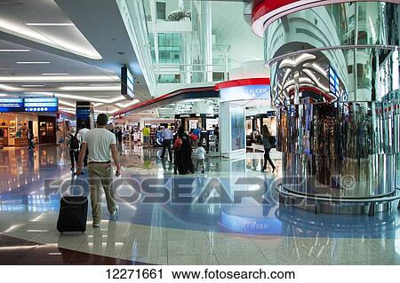Stock Image - Duty free shopping at departures, Dubai Airport; Dubai, United Arab Emirates. Fotosearch