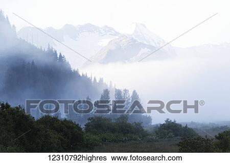 Stock Photograph - Early morning fog in South-central Alaska; Alaska, United States of America. Fotosearch