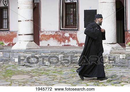 Stock Image - Eastern Orthodox Priest, Rila Monastery, Blagoevgrad, Bulgaria. Fotosearch