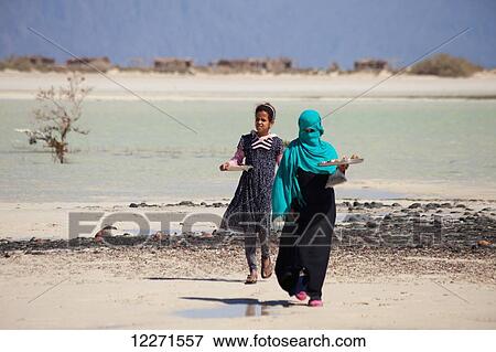 Stock Photo - Egyptian girls selling souvenirs, Nabq National Park; Sharm el-Sheikh, Egypt. Fotosearch