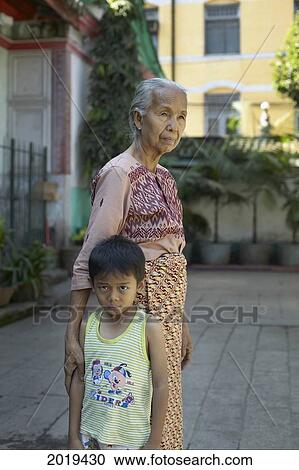 Elderly Woman And Young Boy, Yangon, Myanmar (Burma) View Large Photo Image Stock Image - Elderly Woman And Young Boy, Yangon, Myanmar (Burma). Fotosearch