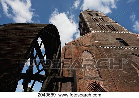 Elevator Wheel Used To Lift Bricks In The Construction Of St. Marien Church, Wismar, Germany View Large Photo Image Stock Photo - Elevator Wheel Used To Lift Bricks In The Construction Of St. Marien Church, Wismar, Germany. Fotosearch