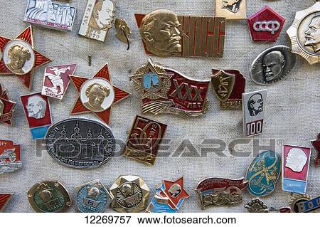 Stock Photo - Enamel badges depicting Lenin and other subjects related to Russian Communist rule for sale at souvenir market stall on St Andrew's Descent; Kiev, Ukraine. Fotosearch