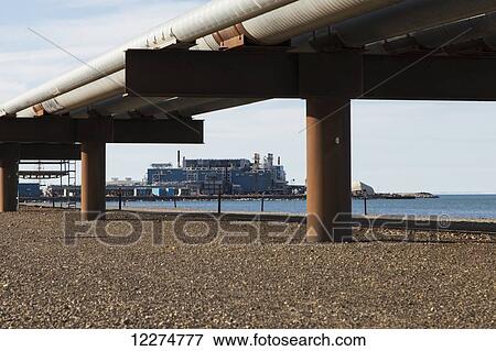 Stock Photo - Endicott oil facility with pipelines in the Prudhoe Bay Oil field, North Slope, Arctic Alaska, Summer. Fotosearch