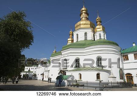 Stock Photograph - Entrance to the lower cave complex at the Pechersk Lavra where pilgrims pray at the glass coffins of mummified monks; Kiev, Ukraine. Fotosearch