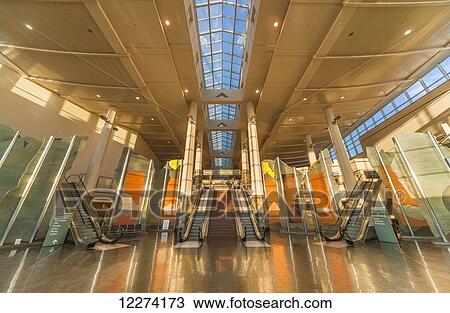 Stock Image - Escalators and Art Instalations at the Ted Stevens Anchorage International Airport, Anchorage, Southcentral Alaska, USA, Fall. Fotosearch