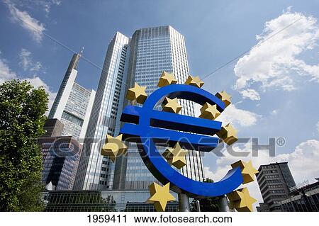 Stock Image - Euro Monument In Front Of The Eurotower, Headquarters Of The European Central Bank In Frankfurt Am Main, Germany. Fotosearch