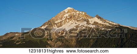 Stock Photograph - Evening light warms Mount Hood; Zigzag, Oregon, United States of America. Fotosearch