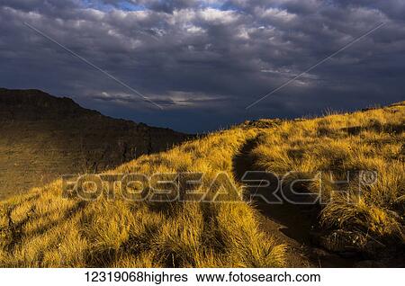Stock Photograph - Evening sun highlights Kiger Gorge at Steens Mountain; Frenchglen, Oregon, United States of America. Fotosearch