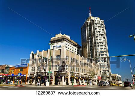 Stock Photo - Exterior of Hilton Anchorage Hotel and gift shops under blue sky, Anchorage, Southcentral Alaska, Summer.. Fotosearch
