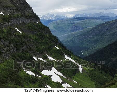 Extreme terrain in mountain range under cloudy sky, Glacier National Park; Montana, United States of America View Large Photo Image Stock Photograph - Extreme terrain in mountain range under cloudy sky, Glacier National Park; Montana, United States of America. Fotosearch