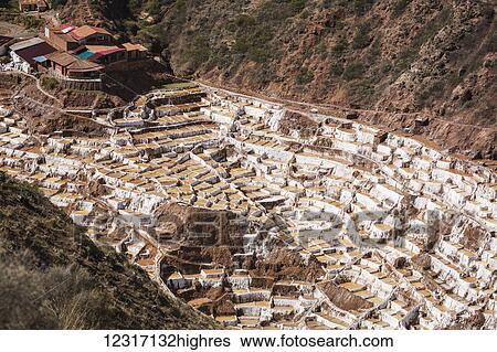Stock Photograph - Family owned salt ponds in Sacred Valley near Urubama; Maras, Cusco, Peru. Fotosearch