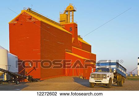 Farm truck in front of old grain elevator; Cabri, Saskatchewan, Canada View Large Photo Image Stock Image - Farm truck in front of old grain elevator; Cabri, Saskatchewan, Canada. Fotosearch