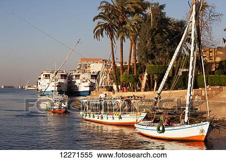 Feluccas on the Nile, outside Sheraton Hotel; Luxor, Egypt View Large Photo Image Stock Photography - Feluccas on the Nile, outside Sheraton Hotel; Luxor, Egypt. Fotosearch