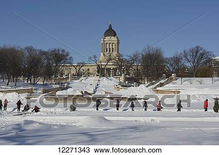 Stock Image - Festival du Voyageur winter festival and Manitoba Legislative Building; Winnipeg, Manitoba, Canada. Fotosearch
