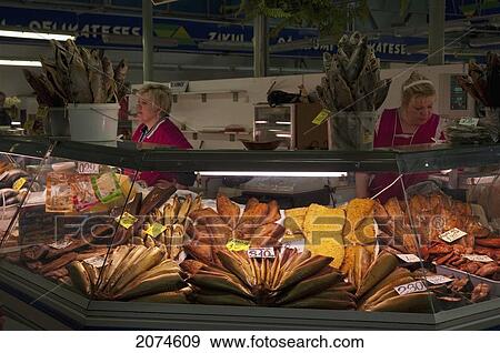 Stock Photo - Fish Monger At The Central Market Housed In Reconditioned Zeppelin Hangars, Riga, Latvia. Fotosearch