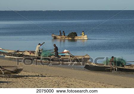 Stock Image - Fishermen Preparing Their Boats In Mangily, Toliara Province, Madagascar. Fotosearch