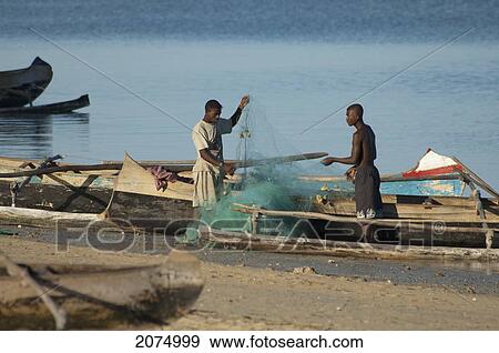Stock Photo - Fishermen Preparing Their Boats In Mangily, Toliara Province, Madagascar. Fotosearch