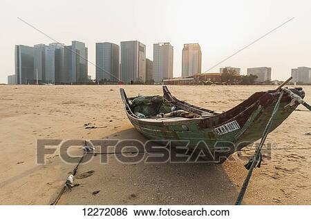 Fishing boat on GuanYinShan Beach; Xiamen, Fujian Province, China View Large Photo Image Stock Photograph - Fishing boat on GuanYinShan Beach; Xiamen, Fujian Province, China. Fotosearch