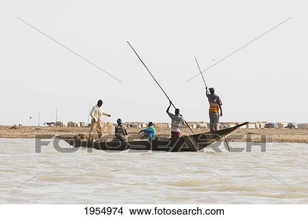 Picture - Fishing boat on Lake Debo, formed by the seasonal flooding of the Niger River, Mali. Fotosearch