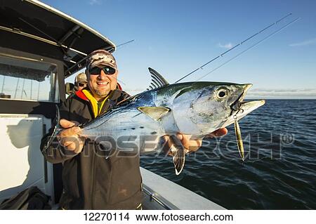Picture - Fishing off the coast of Massachusetts for false albacore; Massachusetts, United States of America. Fotosearch