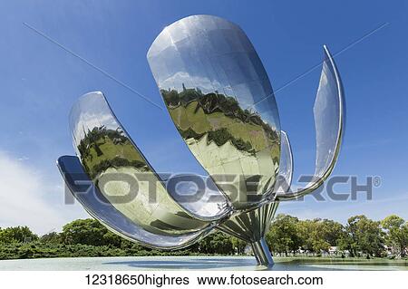 Stock Photograph - Floralis Generica by Eduardo Catalano next to Law Faculty of University of Buenos Aires; Buenos Aires, Argentina. Fotosearch