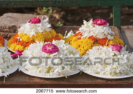 Stock Photography - Flower Offerings For Sale Outside The Mahabodi Temple, Bodhgaya, Bihar, India. Fotosearch