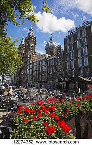 Stock Image - Flowers blossoming near the Central train station; Amsterdam, Holland. Fotosearch