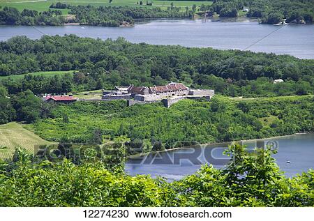 Stock Image - Fort Ticonderoga spreads out along edge of Lake Champlain, viewed from hillside; New York, United States of America. Fotosearch