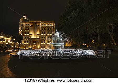 Fountain with the Heydar Aliyev Foundation building in the background at night; Baku, Azerbaijan View Large Photo Image Stock Photograph - Fountain with the Heydar Aliyev Foundation building in the background at night; Baku, Azerbaijan. Fotosearch