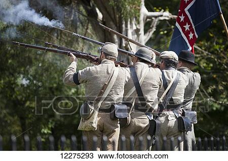 Four American Civil War confederate reenactors firing their rifles in honor of the fallen soldiers at a Civil War cemetery; Munfordville, Kentucky, United States of America View Large Photo Image Stock Image - Four American Civil War confederate reenactors firing their rifles in honor of the fallen soldiers at a Civil War cemetery; Munfordville, Kentucky, United States of America . Fotosearch