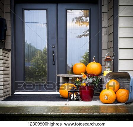 Front door and entrance decorated with pumpkins; Chilliwack, British Columbia, Canada View Large Photo Image Stock Photograph - Front door and entrance decorated with pumpkins; Chilliwack, British Columbia, Canada. Fotosearch