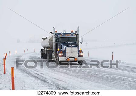Stock Photo - Fuel tanker truck on icy roads in the Prudhoe Bay Oil Field, Arctic Alaska, Winter. Fotosearch