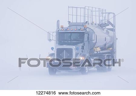 Fuel truck driving in blizzard conditions in the Prudhoe Bay Oil Field, North Slope, Arctic Alaska, Winter View Large Photo Image Stock Photograph - Fuel truck driving in blizzard conditions in the Prudhoe Bay Oil Field, North Slope, Arctic Alaska, Winter. Fotosearch