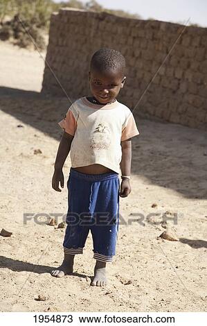 Stock Image - Full length of a boy in Sebi, Mali. Fotosearch