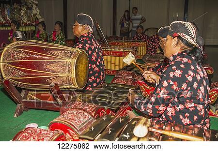 Gamelan orchestra accompanying the Wayang Kulit (shadow puppets) performance by a dalang (puppet master), Yogyakarta, Java Island, Indonesia View Large Photo Image Stock Image - Gamelan orchestra accompanying the Wayang Kulit (shadow puppets) performance by a dalang (puppet master), Yogyakarta, Java Island, Indonesia. Fotosearch