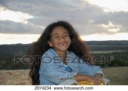 Picture - Girl By La Fenetre Rock Formation, Isalo National Park, Fianarantsoa Province, Madagascar. Fotosearch