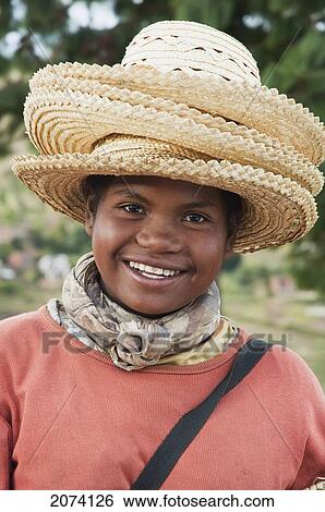 Stock Photograph - Girl Selling Hats In Tritiva, Antananarivo Province, Madagascar. Fotosearch