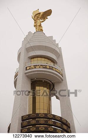 Gold statue of Turkmenbashi on top of Monument of Neutrality; Ashgabat, Turkmenistan View Large Photo Image Stock Image - Gold statue of Turkmenbashi on top of Monument of Neutrality; Ashgabat, Turkmenistan. Fotosearch